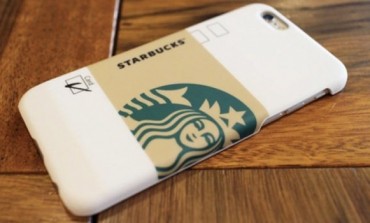 Customers pay for coffee with smartphone case